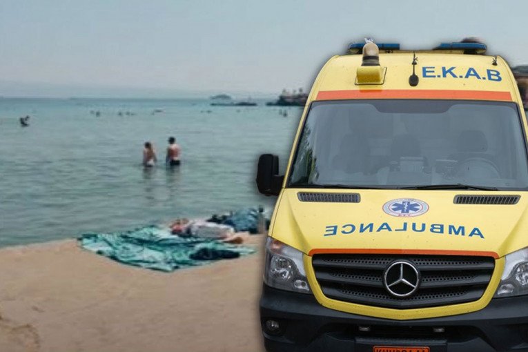 PRVA SLIKA DRAMATIČNOG SPASAVANJA DEČAKA (4) IZ SRBIJE NA PLAŽI U GRČKOJ! Leži umotan u peškir dok spasioci pokušavaju da ga vrate u život! (UZNEMIRUJUĆA FOTOGRAFIJA)